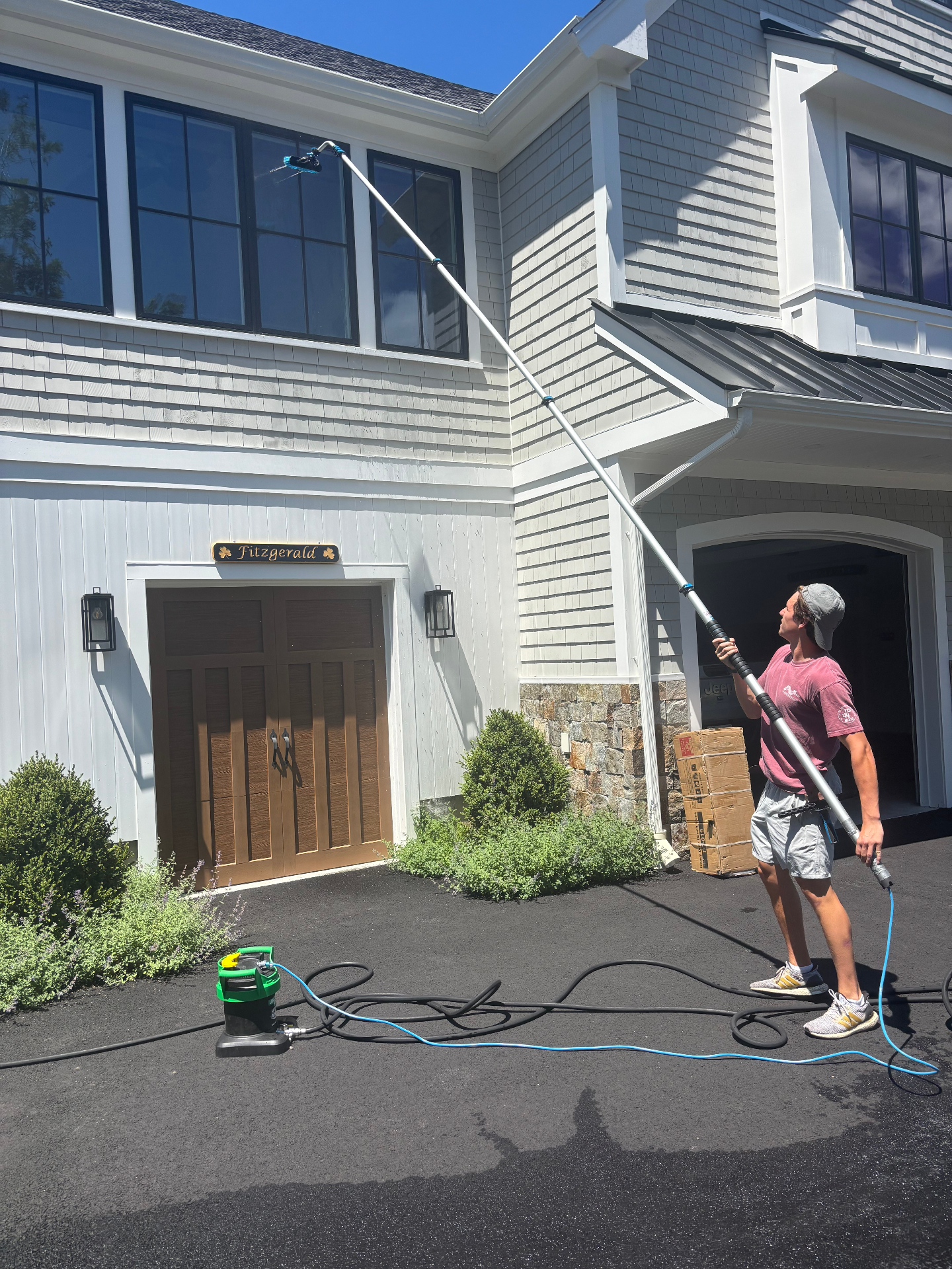 Window cleaning on a Cape Cod home
